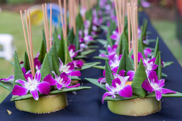 Krathong, the handcrafted floating candle made of floating part decorated with green leaves colorful flowers and many sorts of creative materials for festival Loy Krathong in Thailand