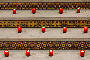Candles placed in the Sacred Heart basilica by Aide a l'Eglise en Detresse charity, Paris, France