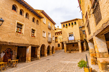 Picturesque Rafael Ayerbe square. Old Plaza Mayor of the Pyrenean town of Alquezar, Huesca, Spain
