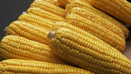 Stacked sweet corn displayed for sale