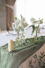 Wedding or event table decorated using white flowers