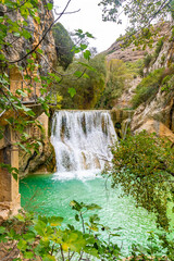 Beautiful landscape in the waterfalls next to the path on the Vero River walkways in Alquezar. Huesca Pyrenees