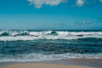 Fototapeta na wymiar Three Tables / Kalahopele Gulch, Pupukea, North Shore, Oahu North Shore, Hawaii. Waves hitting the rocks