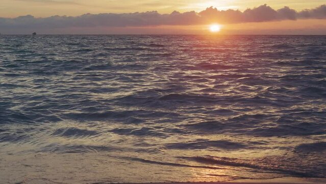 Ocean beach shoreline seascape at sunset. 4k, h265, 30 fps, 4:2:2 10 bit (BT709).