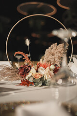 Wedding or dinner table decorated using autumn flowers
