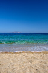 Fototapeta na wymiar Panoramic view of the amazing sandy and turquoise dream beach of Agia Theodoti in Ios Cyclades Greece