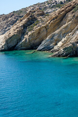 Fototapeta premium View of the most amazing turquoise beach of Tripiti, on a beautiful day on the island of Ios Greece