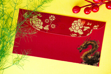Top view of Chinese New Year red packet with golden dragon. Chinese New Year celebrations