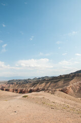 Charyn canyon or the Grand canyon located in the Almaty region of Kazakhstan, vertical shot with blue sky