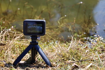 camera on tripod in field