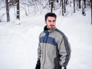 Fototapeta na wymiar Handsome man standing in snow
