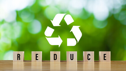 icons related to reduce, on green background with wooden blocks the concept of reduce, reuse,...