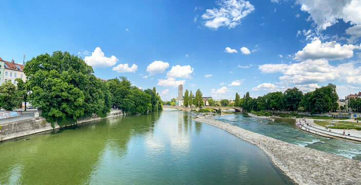 Riverside in Munich with bridge "Wittelsbacherbr&uuml;cke" across the Isar River and view to museum "Deutsches Museum" in summer, Bavaria Germany Europe