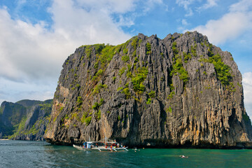 PALAWAN, PHILIPPINES - DECEMBER 21, 2023: Tropical Shimizu Island and paradise beach, El Nido, Palawan, Philippines. Tour A Route. Coral reef and sharp limestone cliffs. 