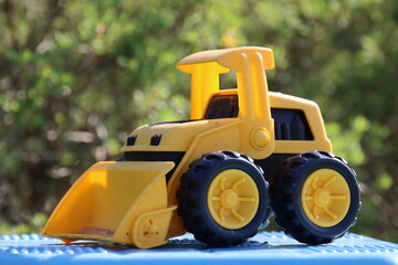 yellow bulldozer on a road