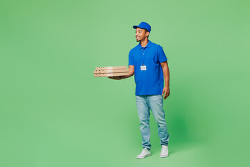 Full body delivery guy employee man wear blue cap t-shirt uniform workwear work as dealer courier...