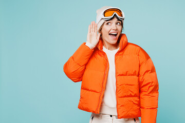 Skier young nosy woman wear padded windbreaker jacket hat ski goggles mask try hear you overhear...