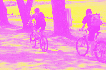Cyclists. Forest Sport. duotone. pink, yellow