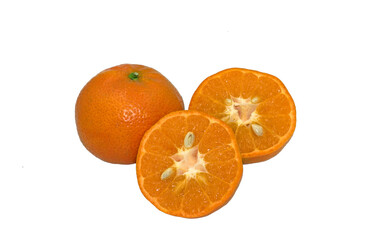 A whole and two halves oranges of mandarin 