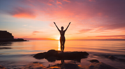 Fototapeta na wymiar person practicing yoga on a beach at sunset