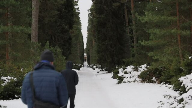 Stockholm, Sweden A father and son walk through the Woodland Cemetery, a Unesco World Heritage site, in winter. 