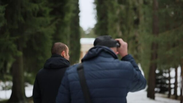 Stockholm, Sweden A father and son walk through the Woodland Cemetery, a Unesco World Heritage site, in winter. 