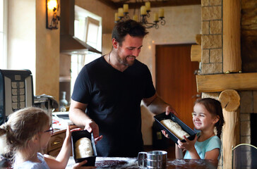 Children cooking homemade bread with there father