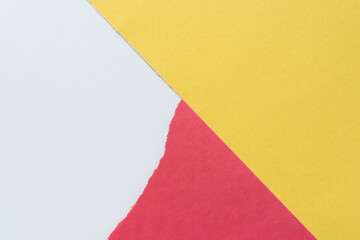 yellow and red construction paper (with torn edge element) on blank paper