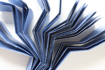 blue construction fanned paper arranged standing with focus on top edge