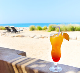 Orange cocktail on the beach