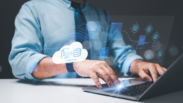 Administrator, armed with a laptop, meticulously manages files, folders, and documents, ensuring the security and efficient backup of critical data for clients in the database administration realm.