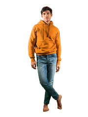 Full body shot of attractive young man with sweater and jeans, isolated on white background