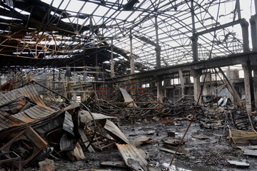 KYIV, UKRAINE - 20231229: A destroyed warehouse with construction materials after a rocket explosion as a result of the attack of the Russian army on Ukraine