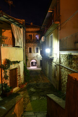 A narrow street between the old houses of Caiazzo, a medieval village in the province of Caserta, Italy.