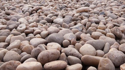 Smooth pebbles on a dry river bed