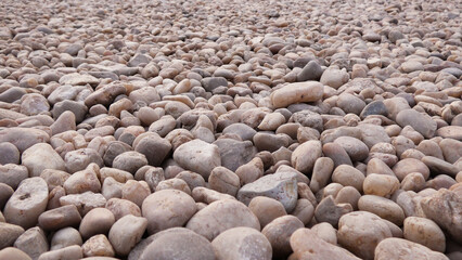 Smooth pebbles on a dry river bed