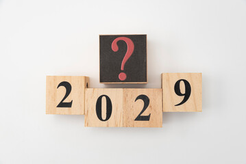 Number 2029 and question mark written on wooden blocks isolated on white background