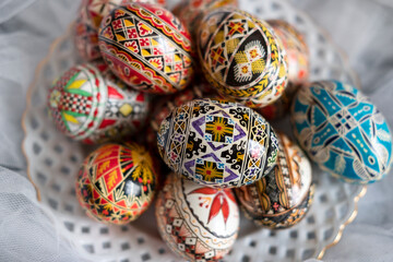 Intricate Easter eggs, part of the Northern Romanian custom of wax coloring and painting elaborate traditional symbols and motifs on the eggshell with a special tool, a drawing pen known as 