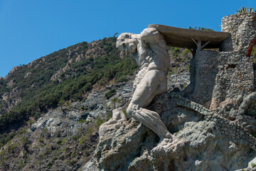 Monterosso, Italy, July 27, 2023. The giant, statue of the giant god Poseidon or Neptune.