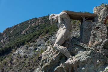 Monterosso, Italy, July 27, 2023. The giant, statue of the giant god Poseidon or Neptune. © JeanMarc