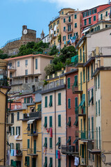 Fototapeta na wymiar Riomaggiore, Italy, July 29, 2023. View of a street with colorful houses