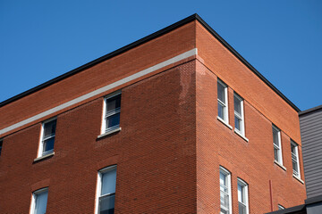 Windows in an old school red brick wall