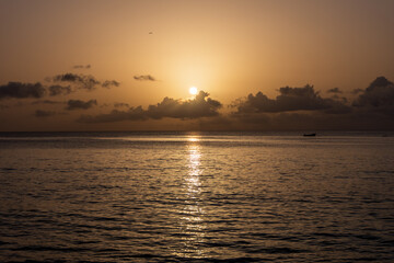 Vivid colorful tropical sunset in Paynes Bay Beach (Barbados).