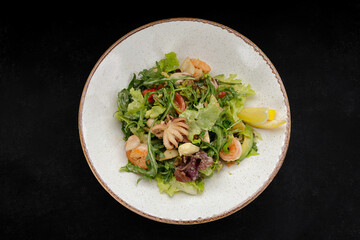 Seafood salad, octopus, shrimp, scallop, squid and mixed greens