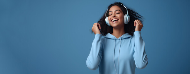 African American teenager young woman with headphone listen to music with happiness, World hearing day. - obrazy, fototapety, plakaty