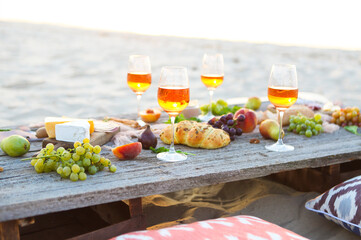 Beach picnic table with rose wine