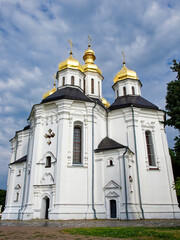 Fototapeta na wymiar In this picturesque moment, Catherine's Church, a splendid example of Ukrainian Baroque architecture, graces the landscape with its iconic white facade and five radiant golden domes.
