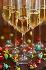 Champagne with pop corn on wooden background