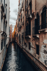 Fototapeta na wymiar Small canal with boats in Venice, Italy