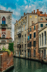 Small canal with boats in Venice, Italy